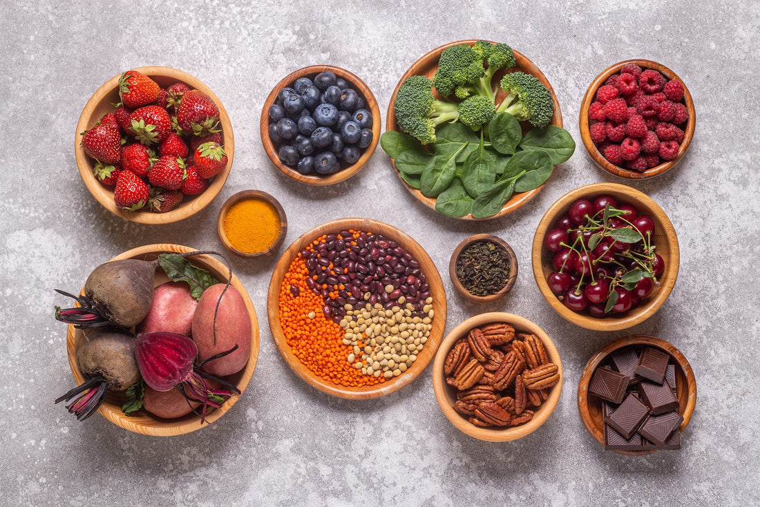 Bowls of colorful fresh fruits and vegetables on a table