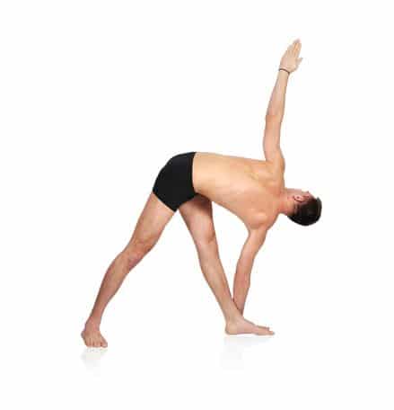 Woman holding a yoga pose on an exercise mat
