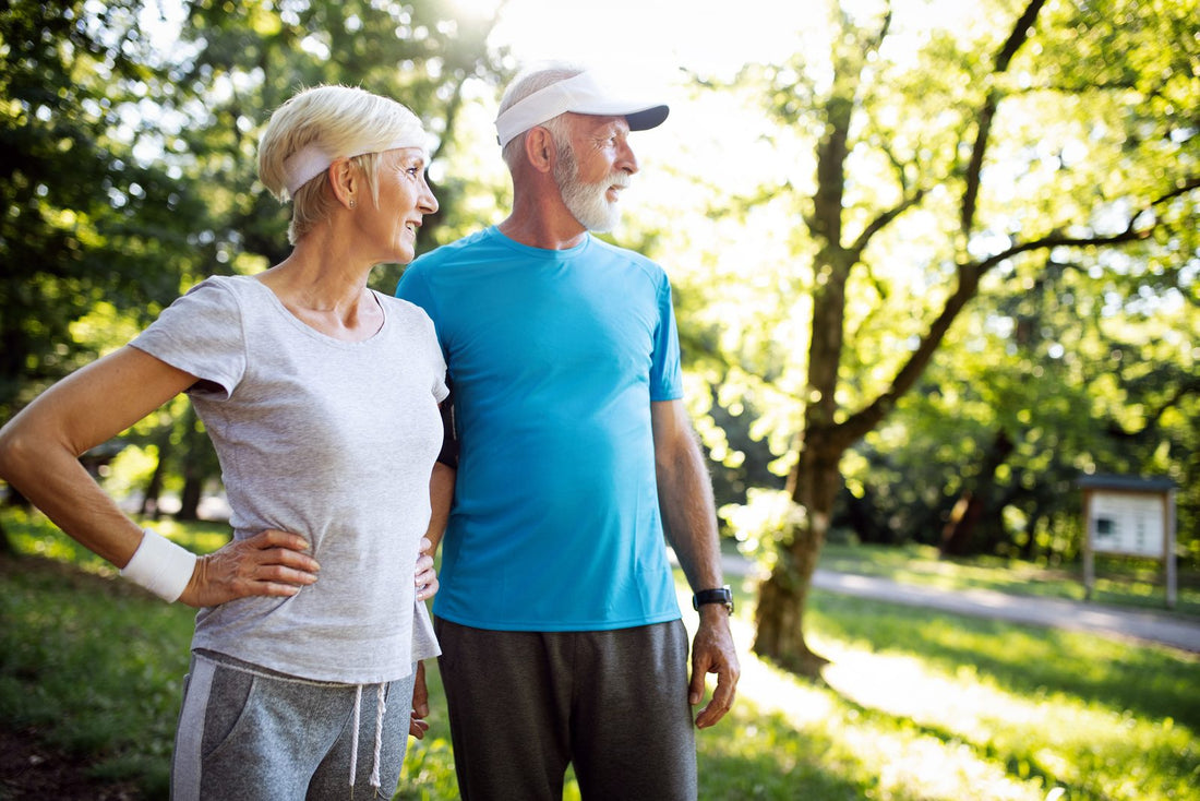 Active senior couple exercising together outdoors